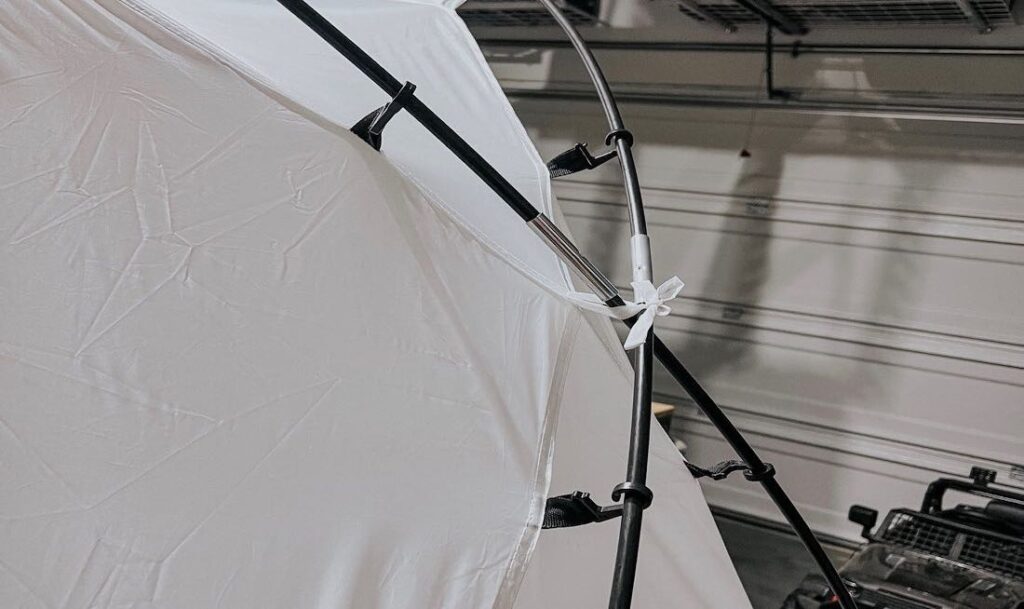 in close shot of a spray tent being set up easily and efficiently