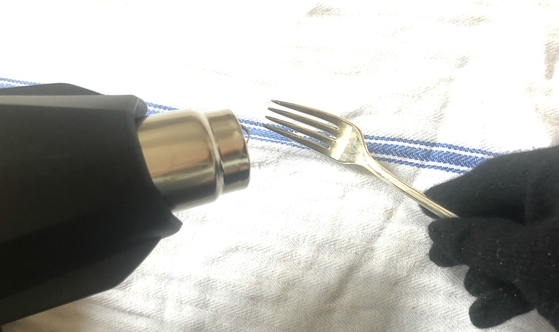 Heat the fork tines