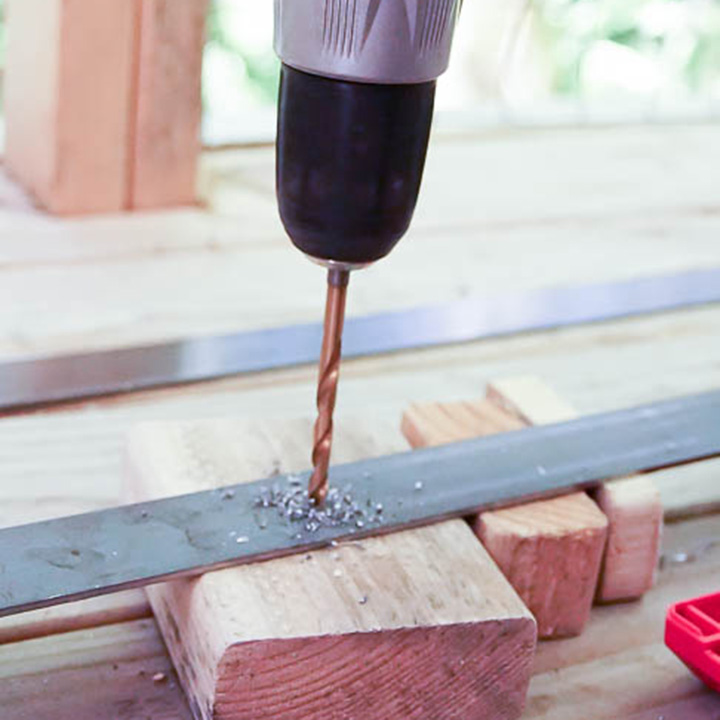 Drill holes into iron