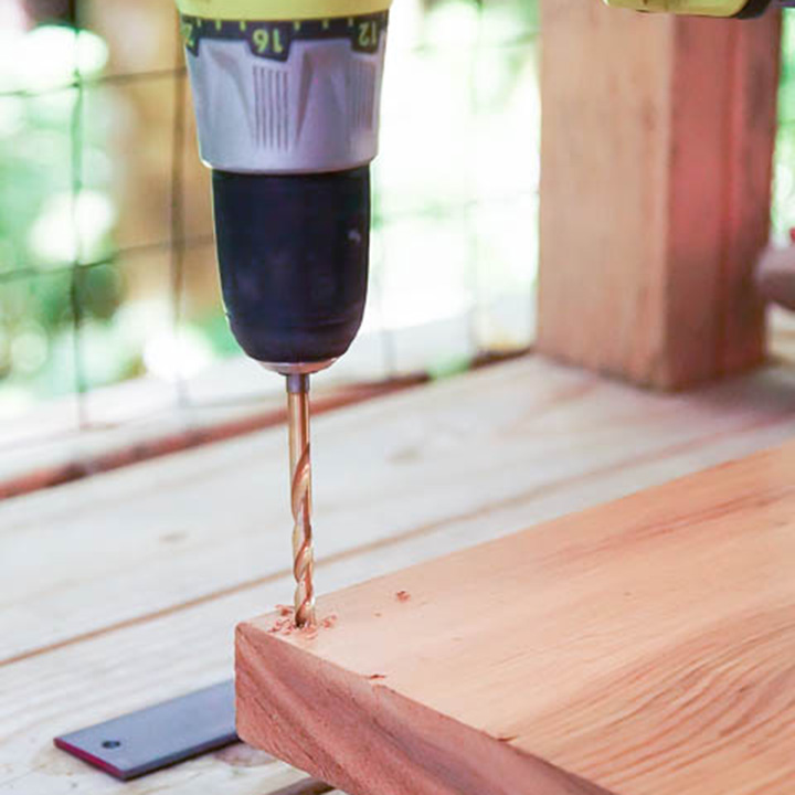 Drill holes into board