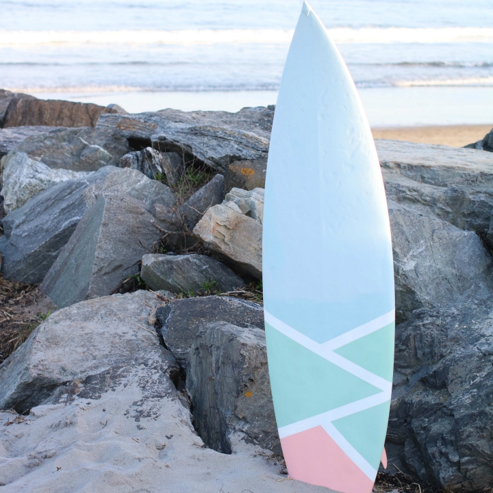 Surfboard painted with a paint sprayer