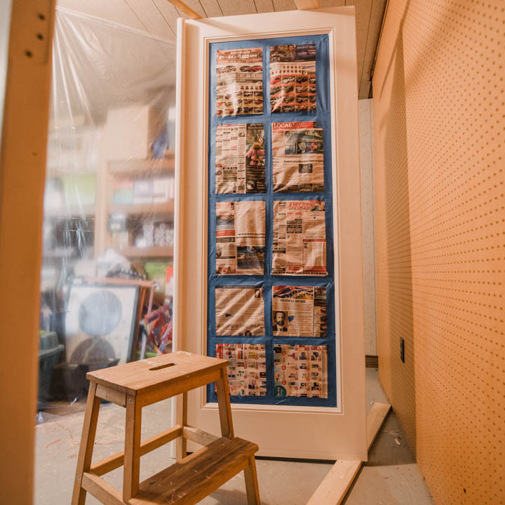 Remove doors and set up spray area